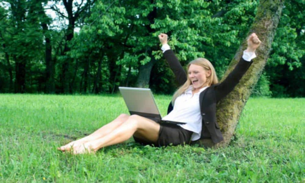 woman-celebrating-looking-at-her-laptop-business-getting-results-featured-image