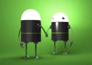 Two robots shaking hands - symbolising automated intelligent networking