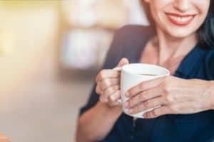 woman drinking coffee relaxing