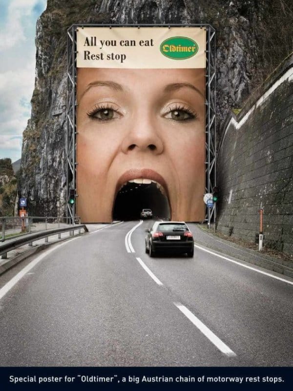 An attention pulling advertisement depicted through a woman's mouth shaped like a tunnel